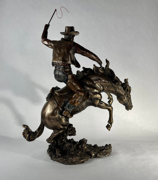 Bucking Bronco with Cowboy Statue