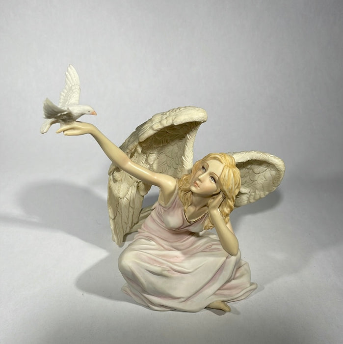 Angel with doves in hand figurine