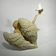 angel with doves statue back view