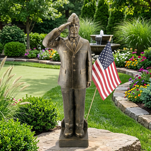 Garden statue of Air Force Airman saluting with an American flag in a garden setting