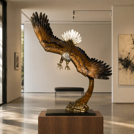 Large bronze eagle statue on black marble base. Gallery setting