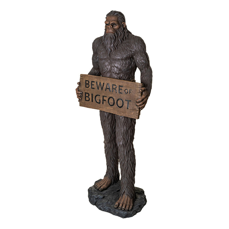 Statue of a "Bigfoot" holding a 'Beware of Bigfoot' sign on a white background