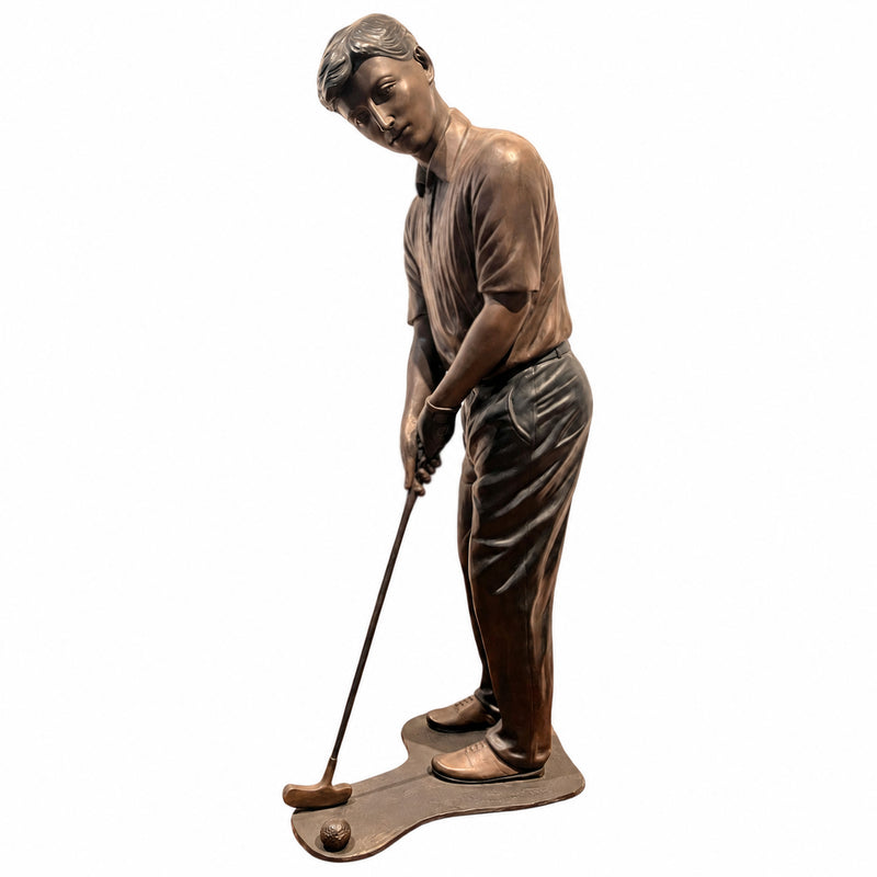 Bronze statue of a boy putting a golf ball