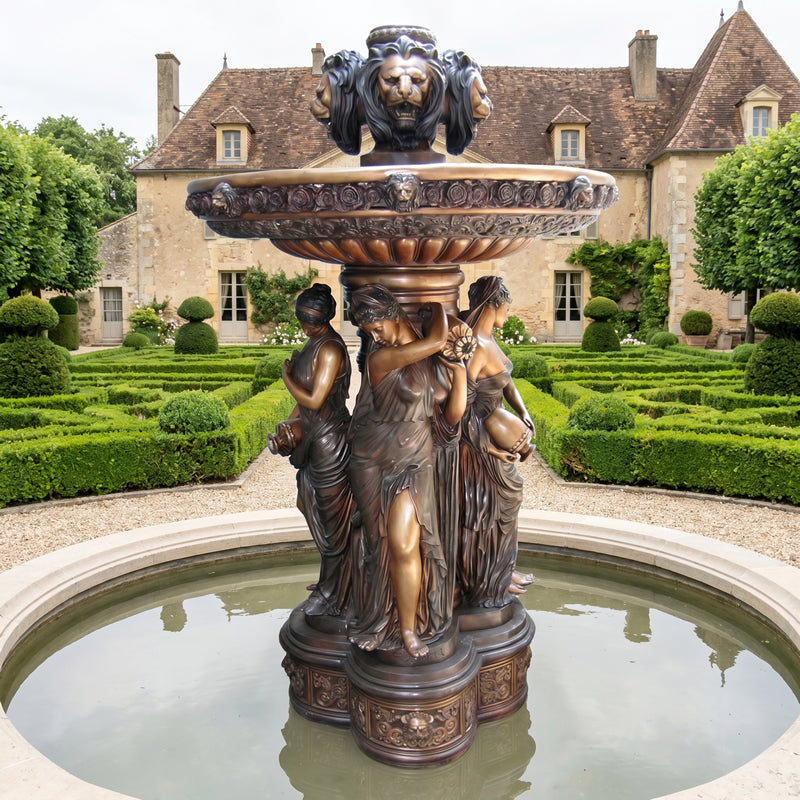 bronze four seasons fountain in formal setting. French country garden ideas