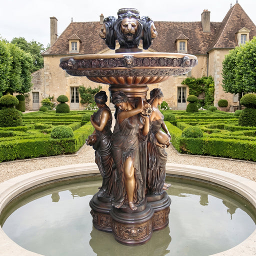 bronze four seasons fountain in formal setting. French country garden ideas