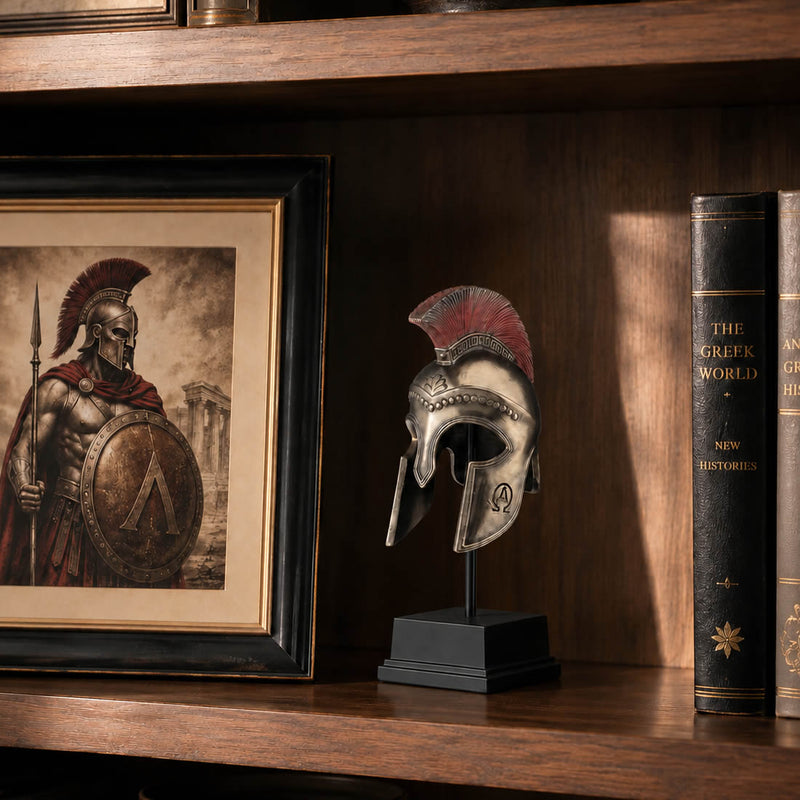 Greek hoplite helmet on stand displayed on bookshelf