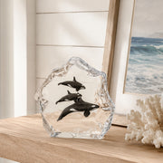 Kitty Cantrell Sculpture called Northern Paradise positioned on shelf with coral and beach painting
