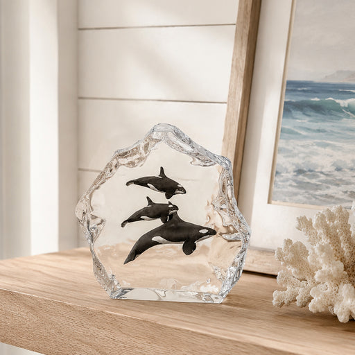 Kitty Cantrell Sculpture called Northern Paradise positioned on shelf with coral and beach painting