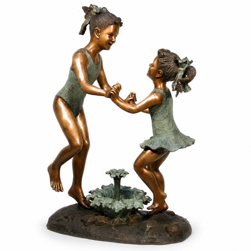 Bronze fountain sculpture of two girls holding hands on a white background