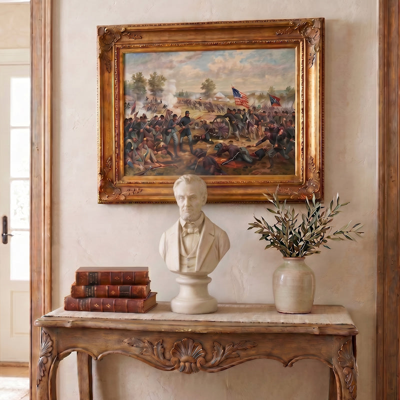 Framed Civil War painting above a decorative console table with a bust of Abe Lincoln, books, and vase.