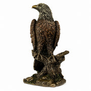 Small American bald eagle statue on white background