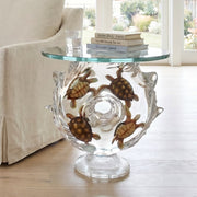 Glass side table with turtle design in a living room setting