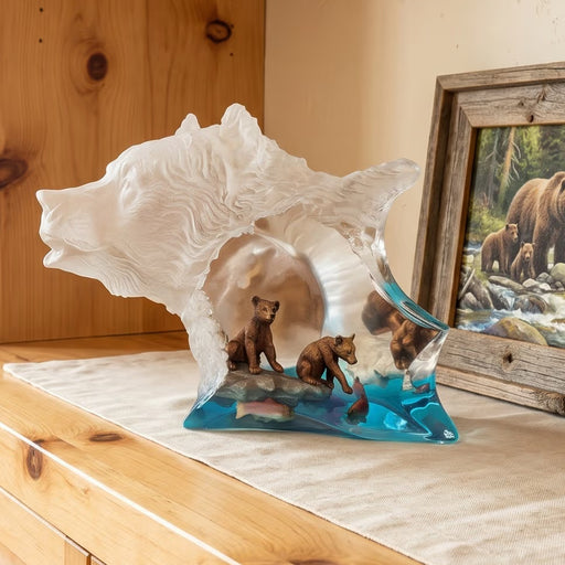 sculpture of bears on a wooden surface.