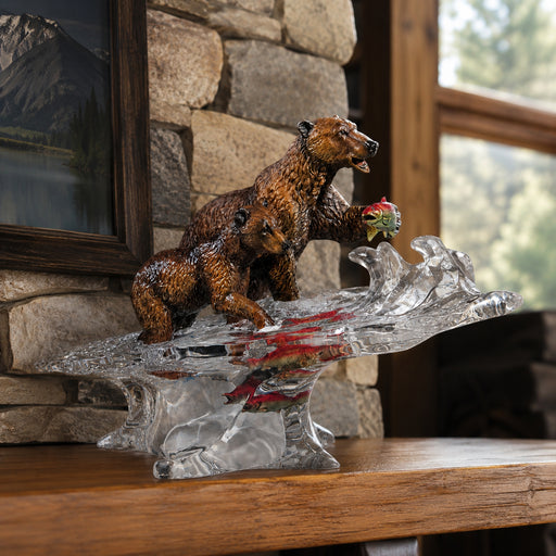 statue of two bears fishing. Positioned on fireplace mantle in lodge home. Name of statue is Training Day by sculptor Kitty Cantrell