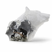 Crystal sculpture of a bear with embedded black bears on a white background