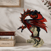 Decorative dragon sculpture on a stone base with books titled 'Tales of the Dragon Realms' and 'The Land of Dragons' in the background.