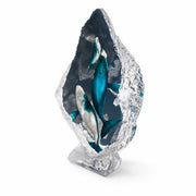 Acrylic sculpture with whales inside on a white background. Artist Kitty Cantrell