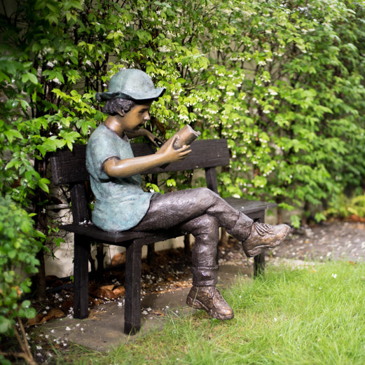 Boy Reading on Bench Bronze Sculpture