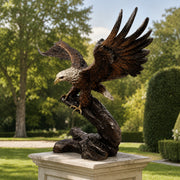 bronze eagle garden statue on pedestal. outdoor park like setting