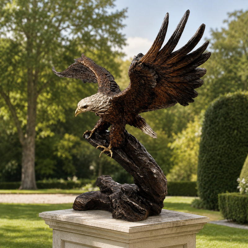 bronze eagle garden statue on pedestal. outdoor park like setting