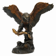 bronze eagle statue with fish 