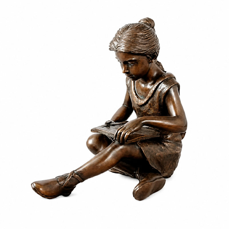 girl reading book bronze sculpture on white background