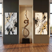 Burnished umber silver gold modern floor sculpture in niche. Abstract paintings on either side.