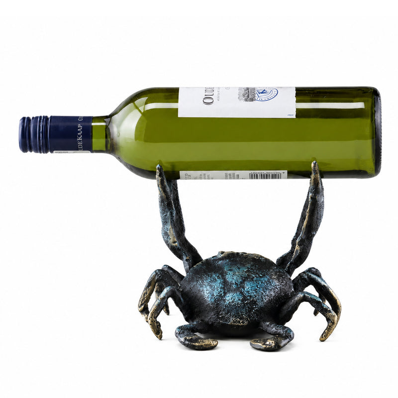 Crab-shaped wine bottle holder with a green wine bottle on a white background