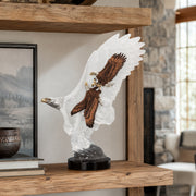 Decorative sculpture of an eagle on a wooden shelf
