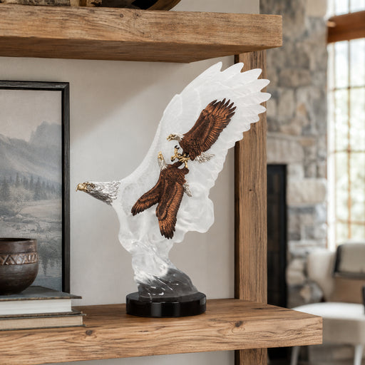 Decorative sculpture of an eagle on a wooden shelf