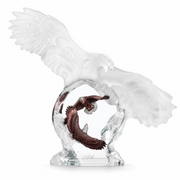Mixed media sculpture of an eagle with outstretched wings on a white background