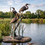 egrets bronze fountain. pond decorating ideas