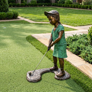 girl playing golf bronze statue