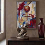 Decorative setup with a sculpture of the Kansas Jayhawks mascot statue, vase, and abstract painting of a basketball scene.