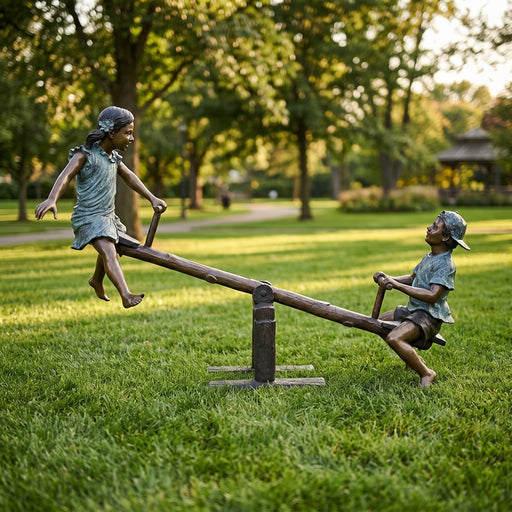 Bronze sculpture of two children on a seesaw in a park setting