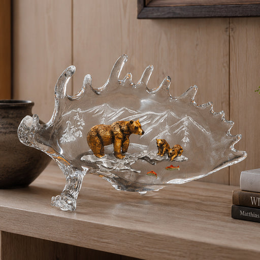 lucite sculpture of mother bear and cubs hunting fish. Title of sculpture: Life Lessons. Artist: Kitty Cantrell