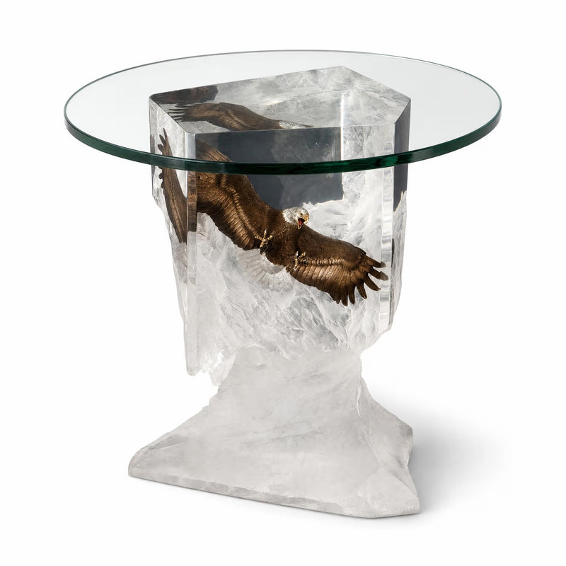 Glass-top table with an eagle sculpture on a white background by Starlite Originals