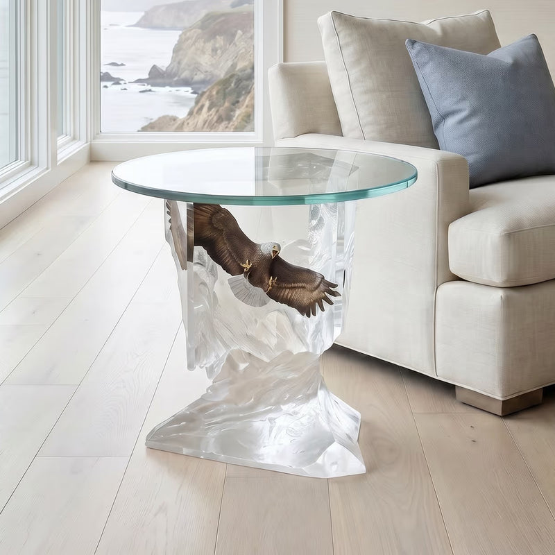 Clear glass table with a unique base design with bald eagle in a living room setting.