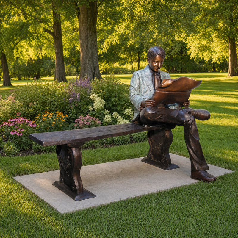 Man Reading Newspaper on Bench Bronze Sculpture