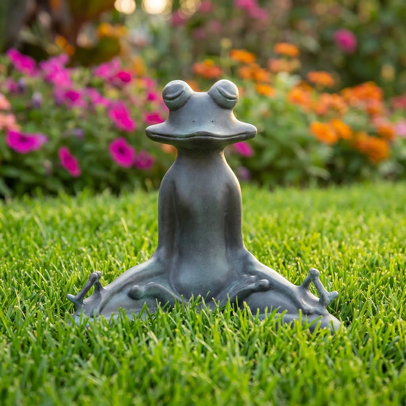 meditating frog garden statue on grass