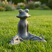 Garden statue of a frog on grass