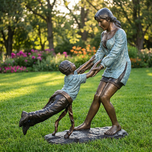 Bronze statue of a woman and child on a grassy area with flowers and trees in the background