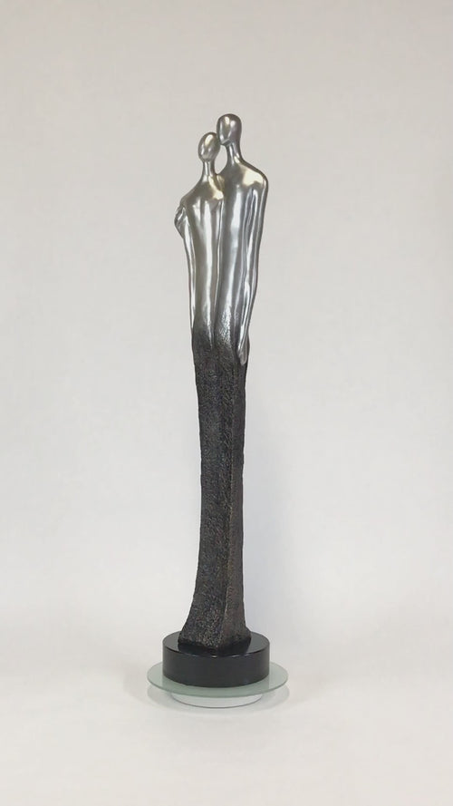 modern floor sculpture of couple silver