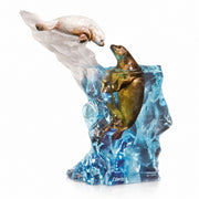 Decorative sculpture of two seals on a rock with water design. Seal it with a Kiss by Kitty Cantrell