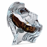 crystal like sculpture of an eagle flying over water