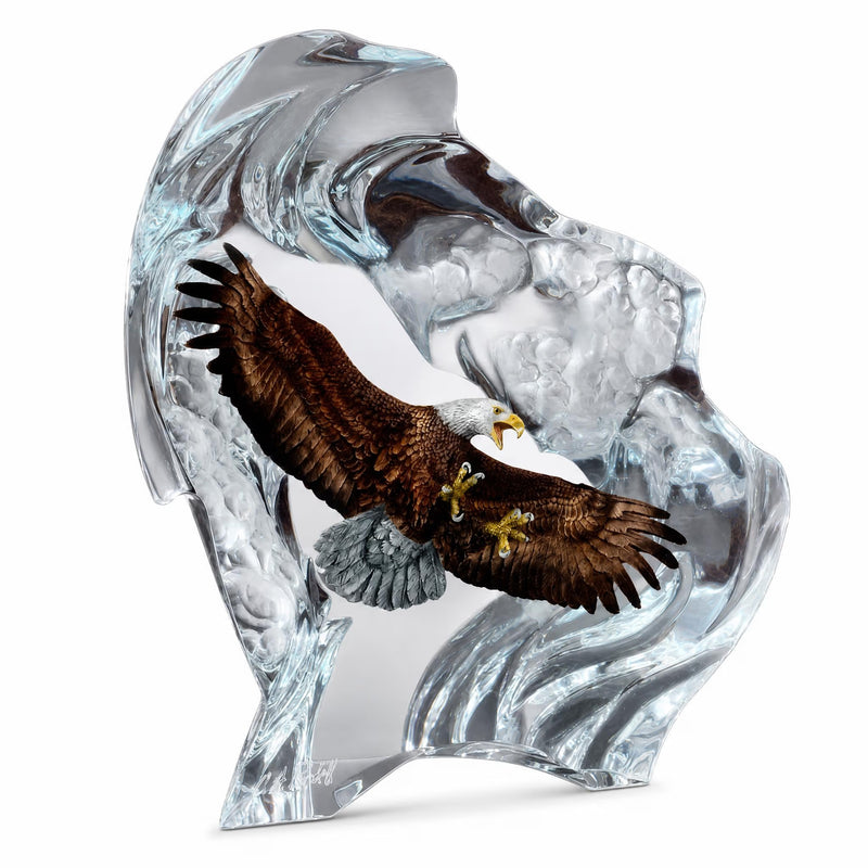 crystal like sculpture of an eagle flying over water