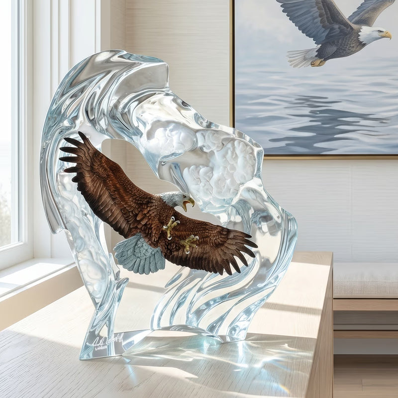 Glass sculpture of an eagle flying through clouds with a painting of an eagle in the background.