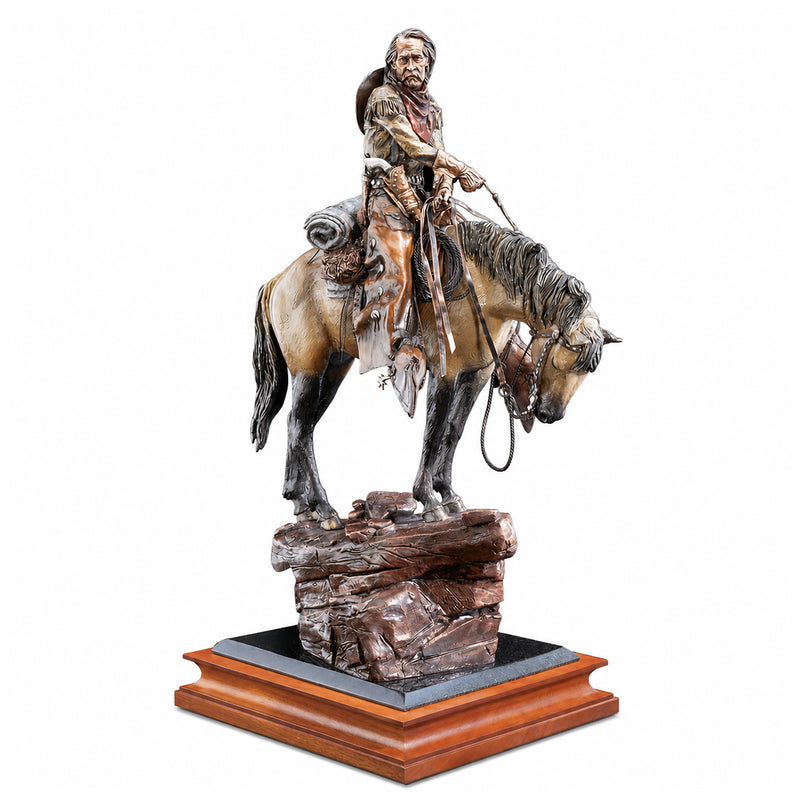 Statue of a cowboy on horseback on a wooden base with a white background. Title of Statue: Thirty and Found. Artist: David Lemon