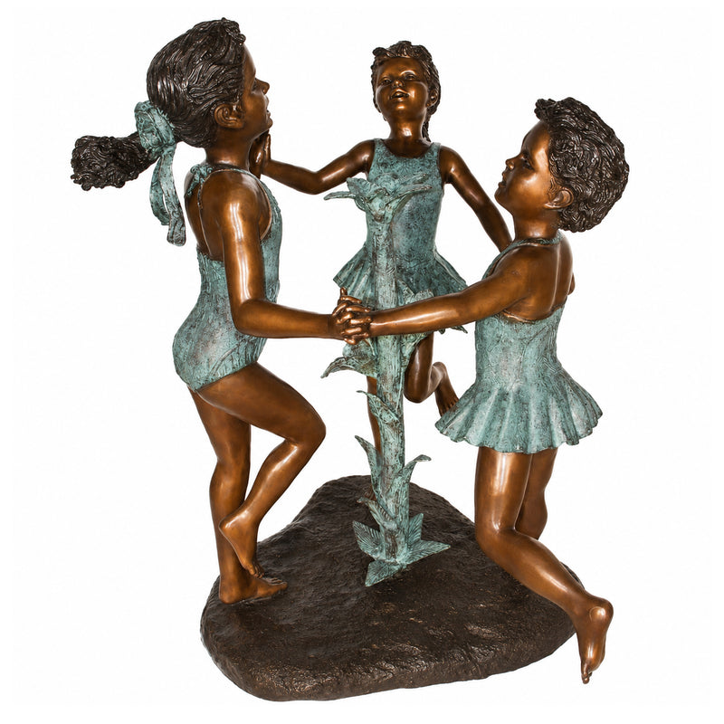 Bronze statue fountain of three dancers on a white background