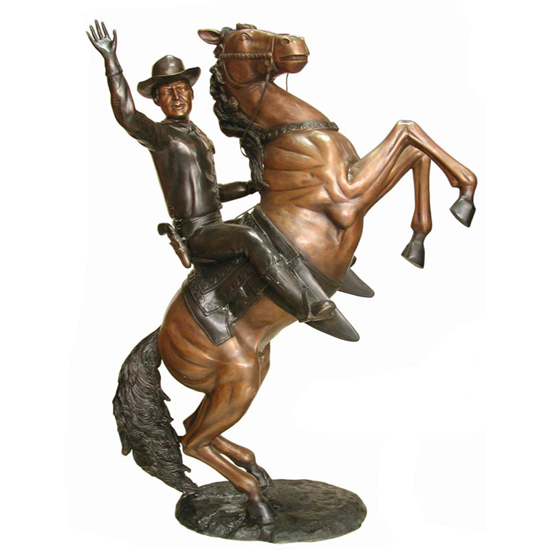 Bronze sculpture of a cowboy riding a rearing horse, cowboy is waving. On a white background